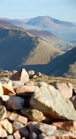 Dodd summit cairn below Red Pike looking towards the Coldale Fells and Newlands Valley