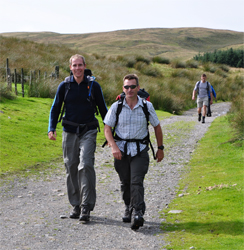 Striding out at Grovebeck Fold at the end of the Lake District 24 Peaks Challenge.